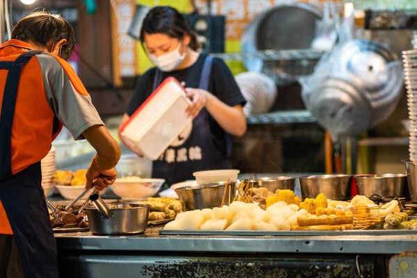 Xitun district, Taichung city, Taiwan - May 11, 2020 : Feng Chia Night Market, famous travel destination. People can seen walking and exploring around it. Big part of Taiwanese culture
