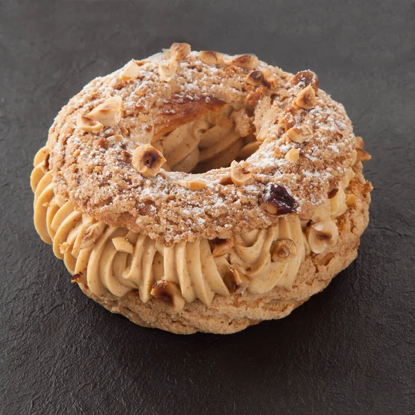 Paris-brest french pastry on slate — Stock Photo, Image