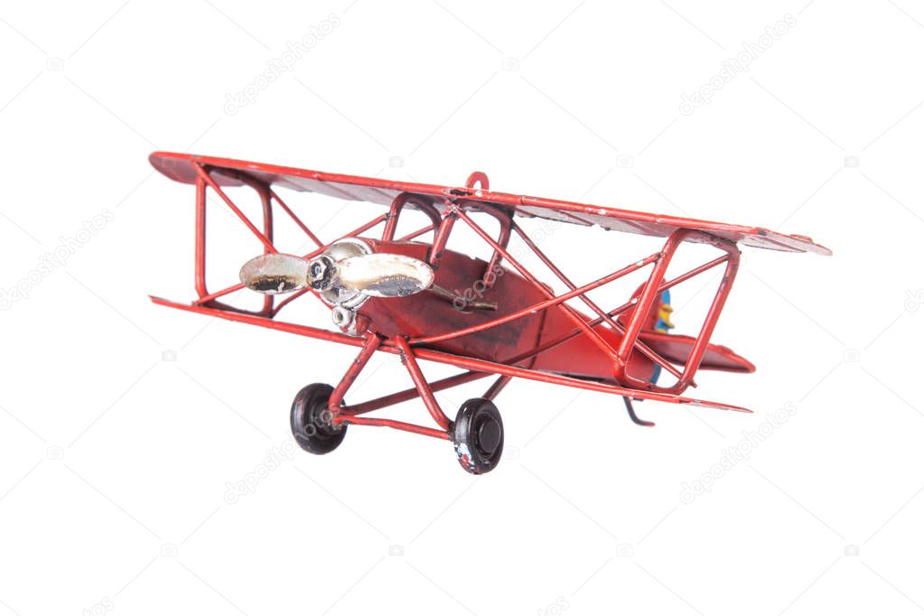 red toy plane face isolated