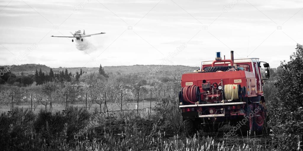 B&W and red photography red firefighter truck and plane take wat