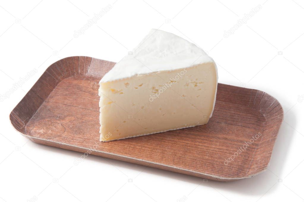 portion camembert cheese on a wood plate  isolated