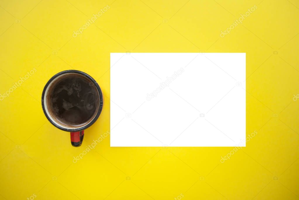 A cup of coffee on yellow background.