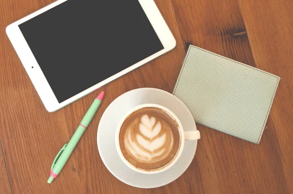Flat lay of coffee, tablet, pen and notepad. — Stock Photo, Image