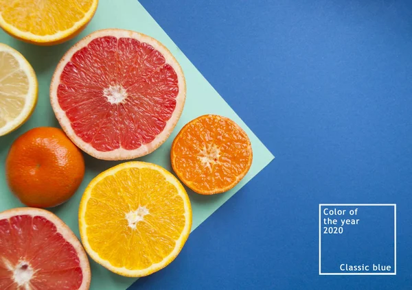 Ripe grapefruit on blue background.