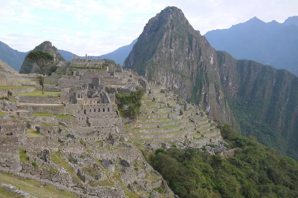 The ancient Lost City of Machu Picchu with the mountain Huayana Picchu in the background. The city is near Cusco in the Urubamba Province Peru