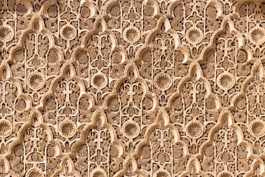 MARRAKECH, MOROCCO - APR 29, 2016: Detailed view of the Ben Youssef Madrasa. A former Islamic college in Marrakech, Morocco. clipart