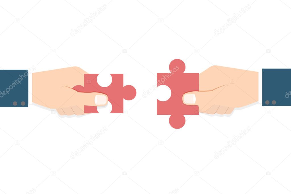 Businessman hands  holding puzzle 