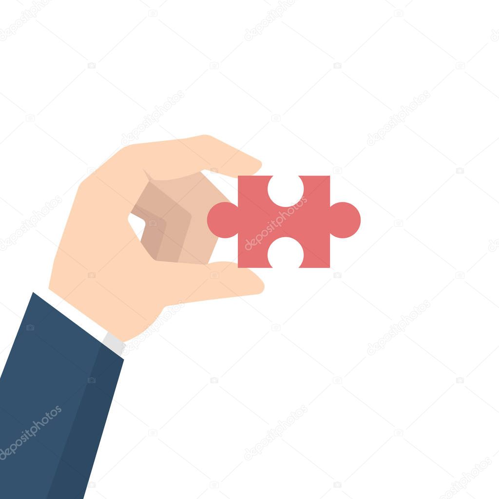 Businessman Hand holding puzzle 