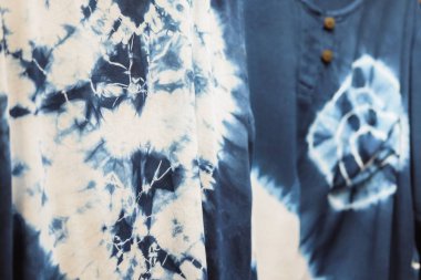 Tie dye shirts with blue and white.