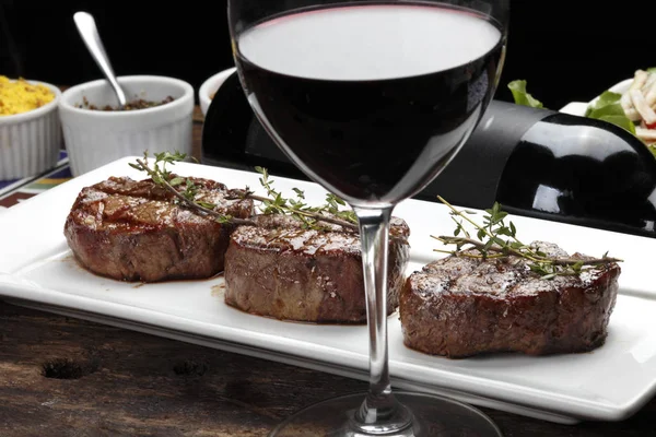 Three steaks roasted on the grill — Stock Photo, Image