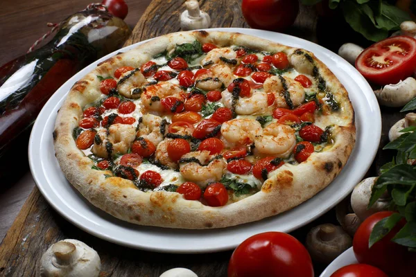 Seafood pizza with cherry tomatoes — Stock Photo, Image