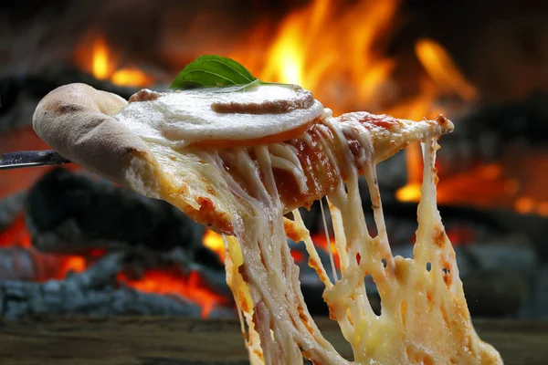 Hot pizza slice with melting cheese — Stock Photo, Image