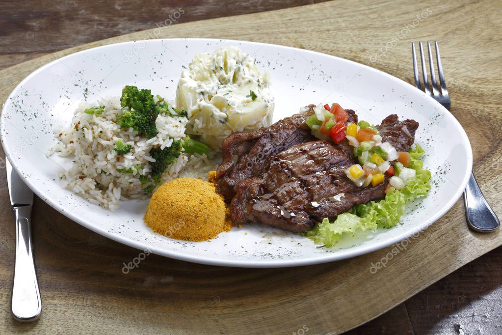 grilled steak with salad and garnish