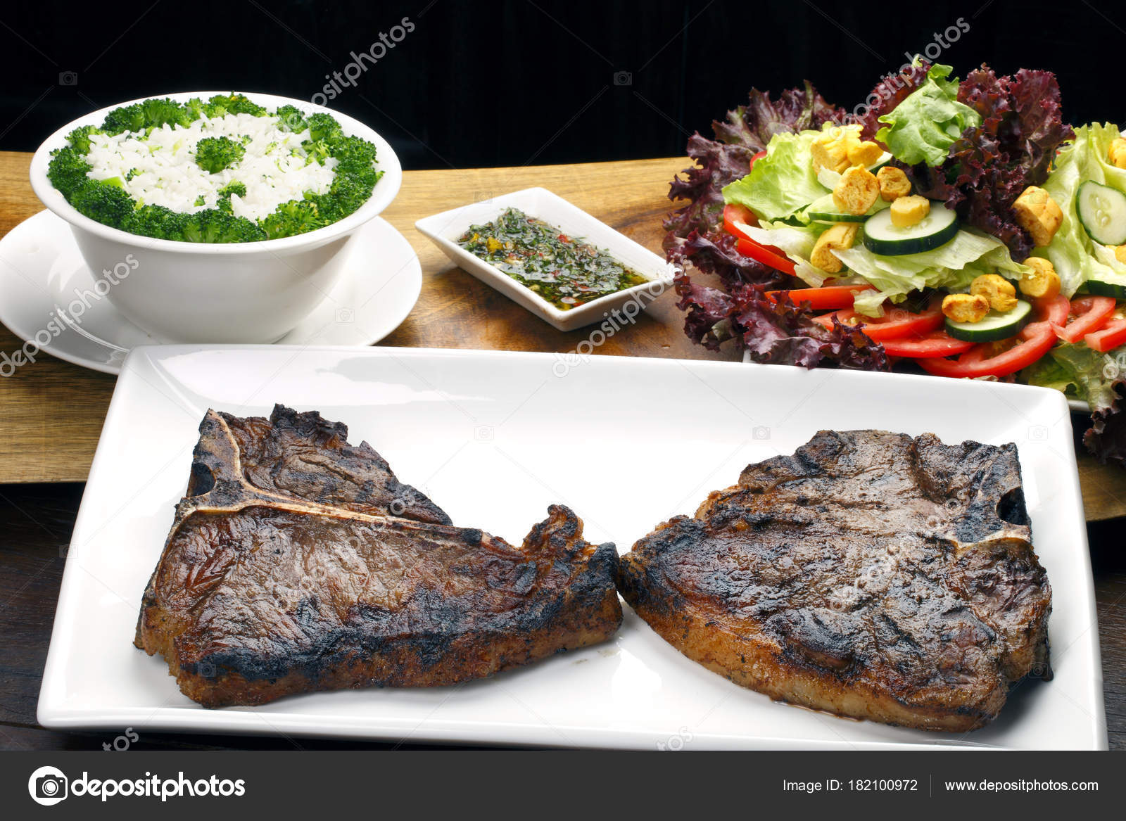 Tender Grilled Porterhouse Bone Steaks Garnish Stock Photo by