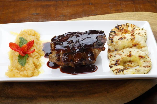 Ribs with bbq sauce and pineapples