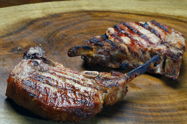 Roasted lamb ribs on wooden board