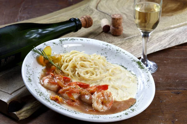 Appetizing pasta with shrimps and white sauce