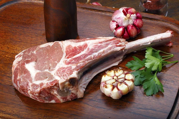 Raw Tomahawk Steak Garlic Herbs Wooden Board — Stock Photo, Image
