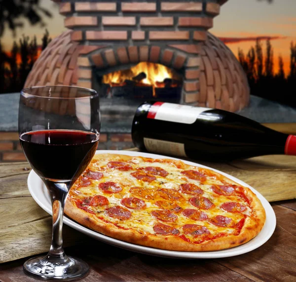 tasty pepperoni pizza and red wine set, close-up view