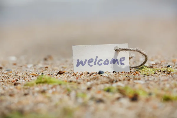 Bienvenido - signo en la playa —  Fotos de Stock