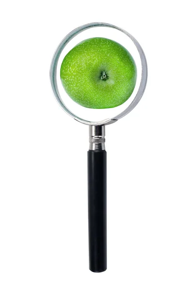 Green apple throw Magnifying glass, on a white background — Stock Photo, Image