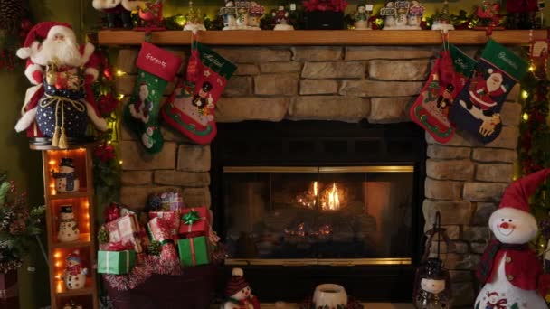 Indoor Christmas Decor Scene Fire Fire Place Stockings Santa Claus — Stock Video