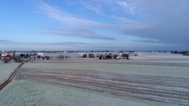 Aerial View of Amish Countryside in Early Morning After a Light Snow Fall as Seen by a Drone