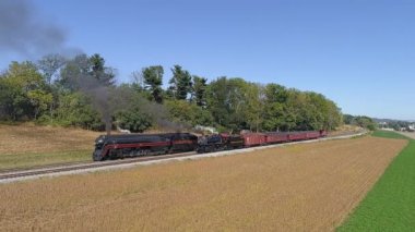 Strasburg, Pennsylvania, October 2019 - An Aerial View of Two Norfolk and Western Steam Locomotives No 611 and No 475 Steaming Up on Two Tracks in the Countryside