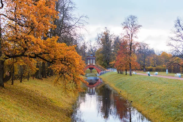 Autumn landscape with a Cross bridge. — Stock Photo, Image