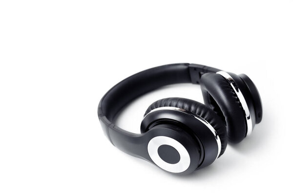 Black stylish professional wireless headphone on white background. High-quality music studio headset