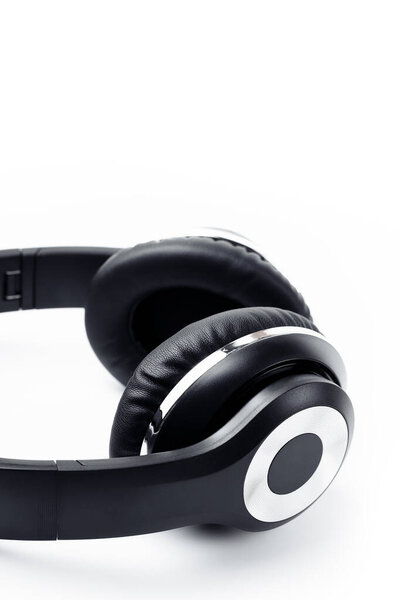 Black stylish professional wireless headphone on white background. High-quality music studio headset