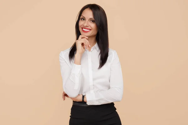Charming young modern business woman standing over beige background. — Stock Photo, Image