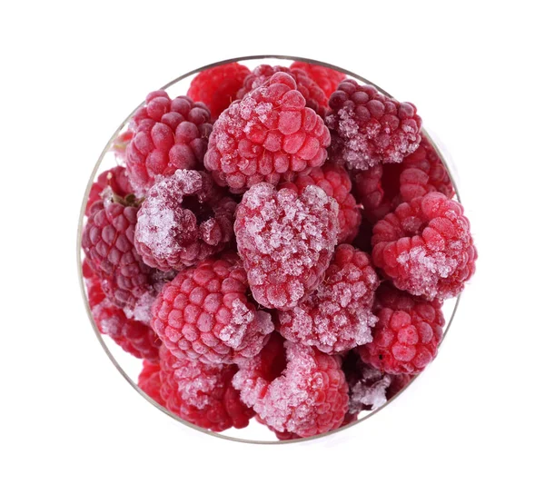 Red frozen raspberries in a glass cup — Stock Photo, Image