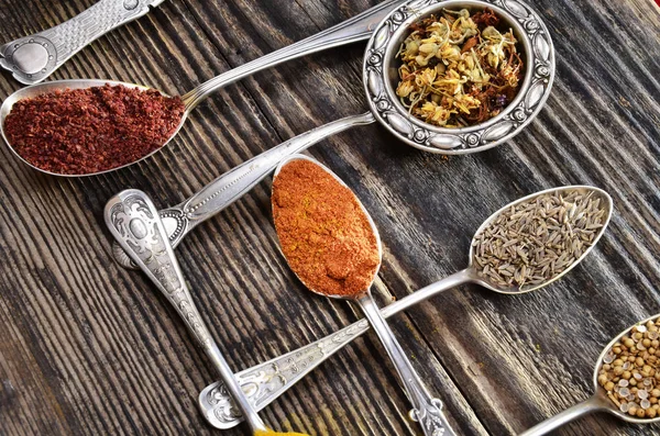 Various colorful spices on a wooden — Stock Photo, Image
