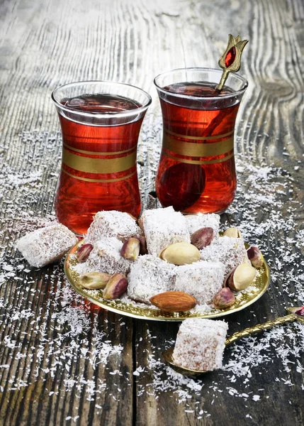 Turkish delight with coconut and tea — Stock Photo, Image