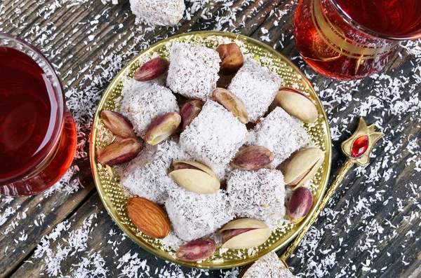 Turkish delight with coconut and tea — Stock Photo, Image