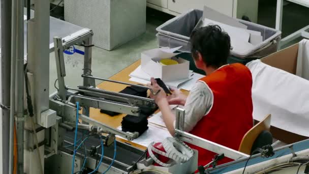 Female Worker in a Sock Factory — Stock Video