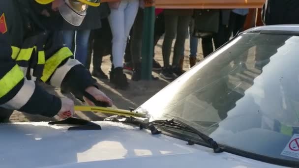 Fireman Rescue Firefighter Rescuer Breaks Car Glass Injured Driver Demonstration — Stock Video