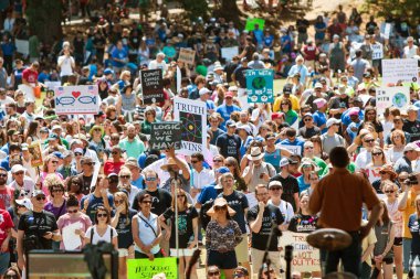 Thousands Listen To Speaker At Atlanta Earth Day Rally clipart