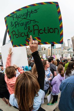 Woman Raises Sign At Atlanta March For Our Lives Event clipart