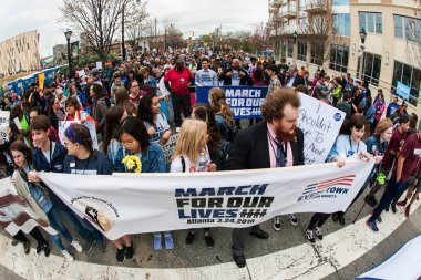 Thousands Line Up Behind Banner At March For Our Lives clipart