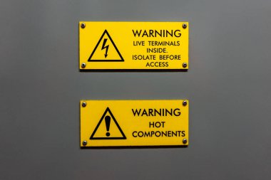 Dual live terminals inside and hot components warning sign