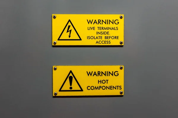 Dual live terminals inside and hot components warning sign — 图库照片