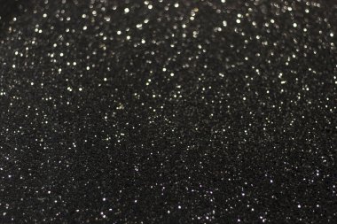 Beyaz parıltılı siyah yüzey ve bokeh. Siyah ve beyaz arka plan. Bulanık kenarlıklar.