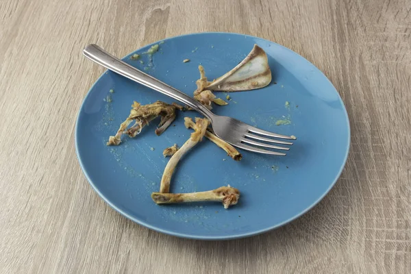 Dirty Greasy Plate Fork Rabbit Bones Wooden Table — Stock Photo, Image