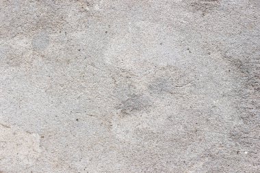 Eski gri beton kaplama. Doğal taş yüzeyi.