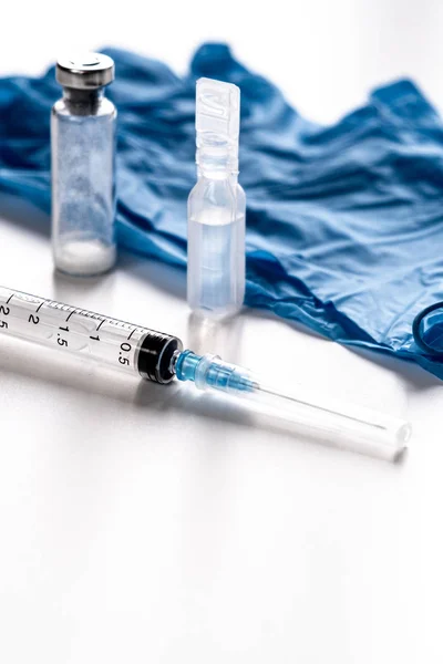 Syringes, water for injections, ampoules medical gloves. The concept of vaccination. — Stock Photo, Image