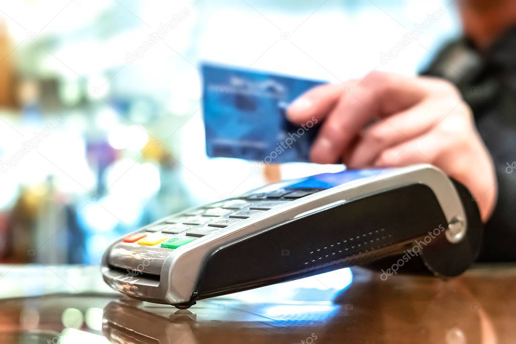 Buying groceries in a hypermarket. Credit card payment.