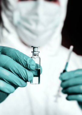Laboratory scientists are investigating a vaccine against coronavirus. Struggle against epidemics. clipart