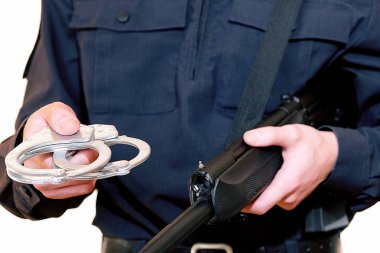 Police officer. With weapons in service. Performs official duties. The inscription in Russian police.